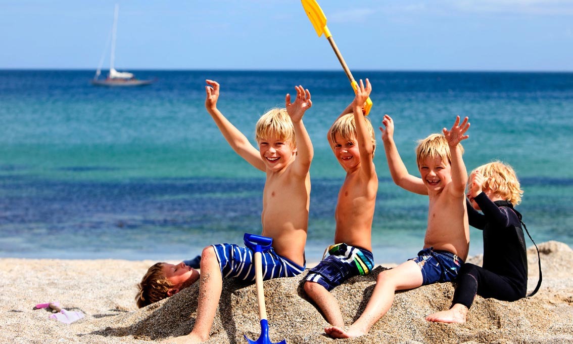 Children enjoying on the beach